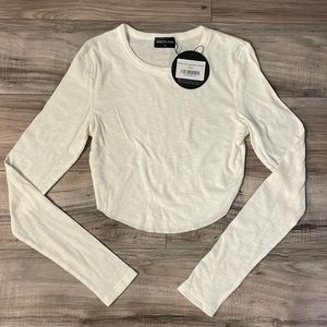 Women’s White Fox long sleeve crop top. Size medium